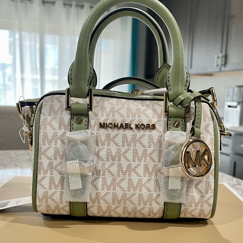 Brand new Michael Kors Bedford Legacy crossbody duffle bag in light sage.